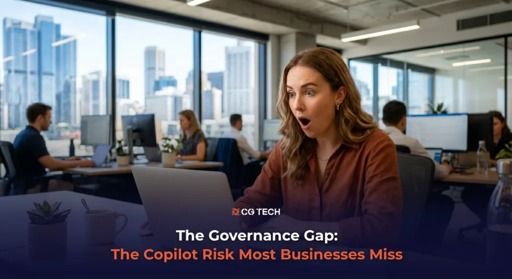 A business professional reacts with surprise at her laptop in a modern Australian office, representing the hidden data security risks businesses face when adopting Microsoft Copilot.
