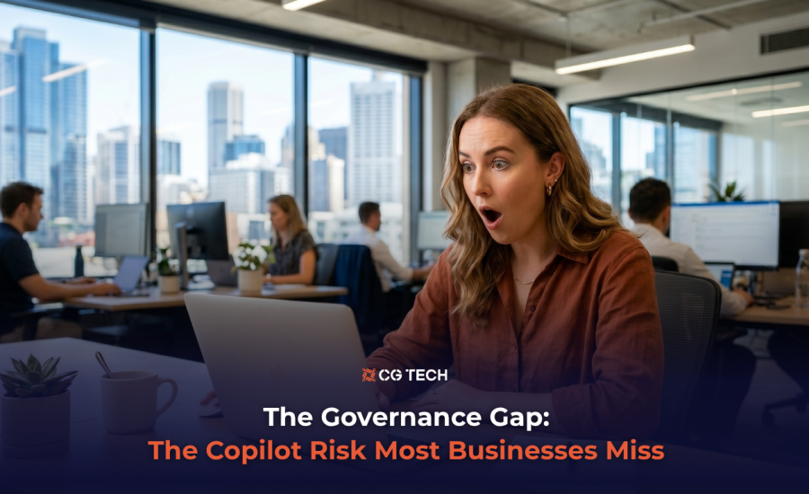A business professional reacts with surprise at her laptop in a modern Australian office, representing the hidden data security risks businesses face when adopting Microsoft Copilot.