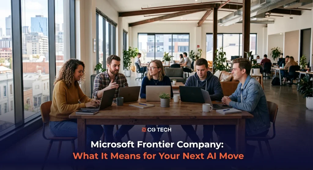 Team of business professionals collaborating on laptops in a modern office, discussing Microsoft's new Frontier Company AI announcement.