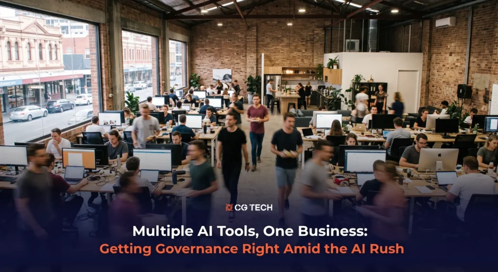 Business team collaborating in an open-plan office, illustrating CG TECH's blog on AI governance across ChatGPT, Copilot and Claude.