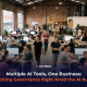 Business team collaborating in an open-plan office, illustrating CG TECH's blog on AI governance across ChatGPT, Copilot and Claude.