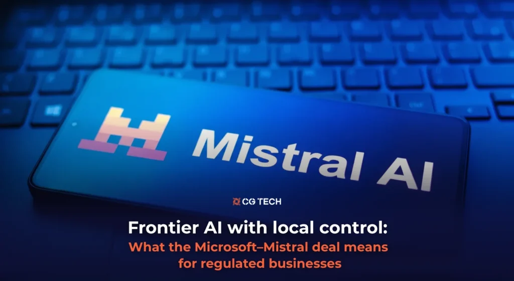 Mistral AI logo on a smartphone screen resting on a keyboard, illustrating the Microsoft–Mistral partnership for CG TECH's article on frontier AI and data control for regulated businesses.